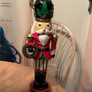 Tall nutcracker figurine red green green black white